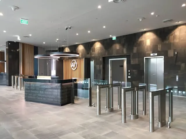 Modern turnstile gate system for commercial property security and access control in Sydney CBD building lobby.